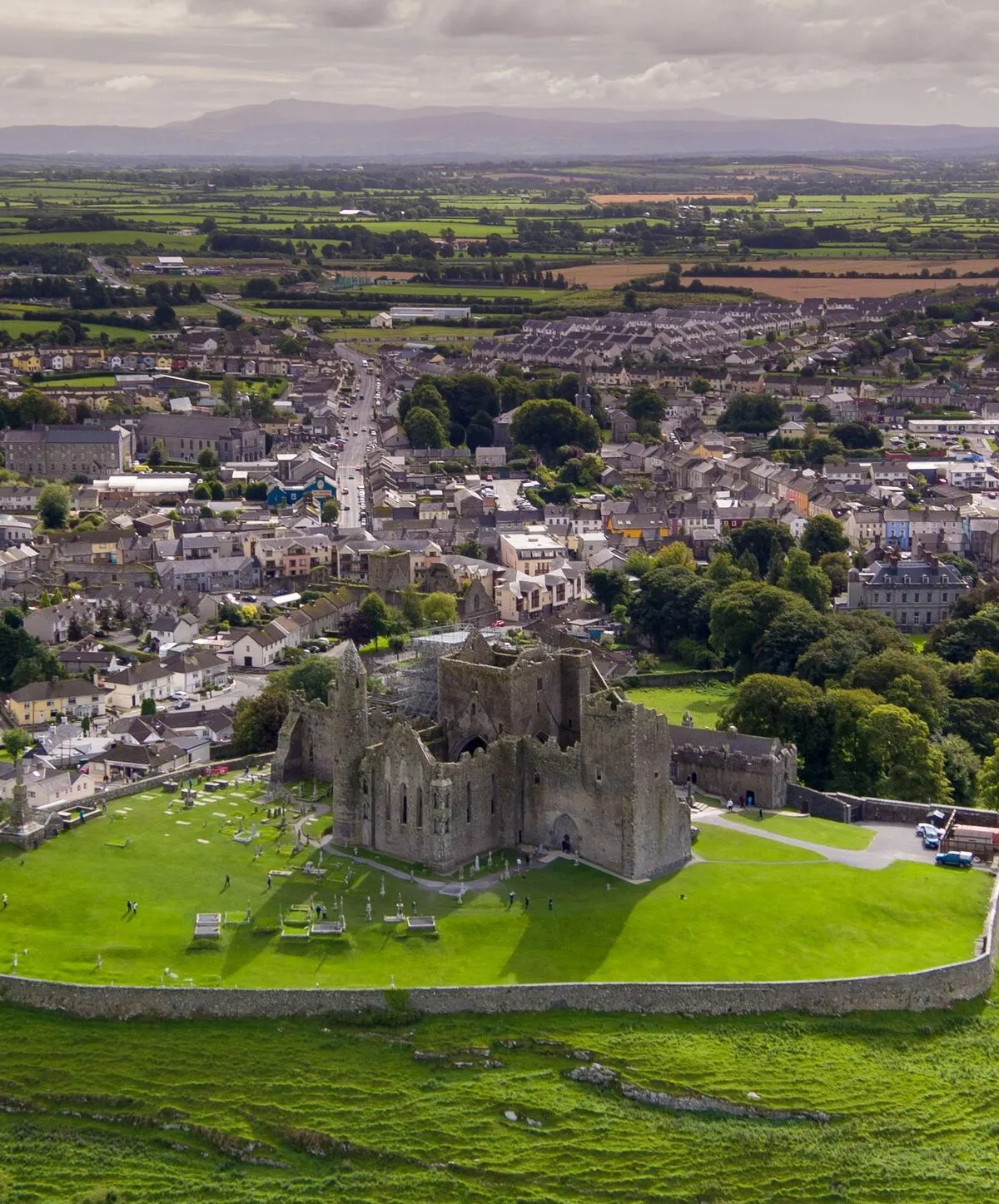 The Rock of Cashel from the air, the town of Cashel around it and the farmland of the Golden Vale running to the hills beyond