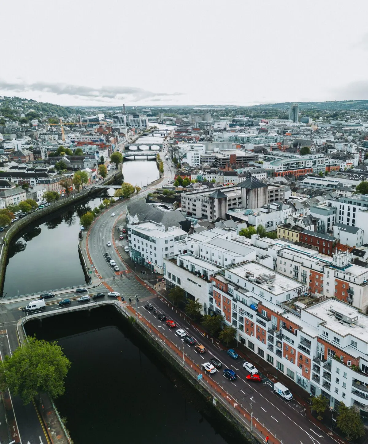Cork city from the air looking west along the north channel of the River Lee, the quay road and its terrace running beside the water with the bridges and the city beyond