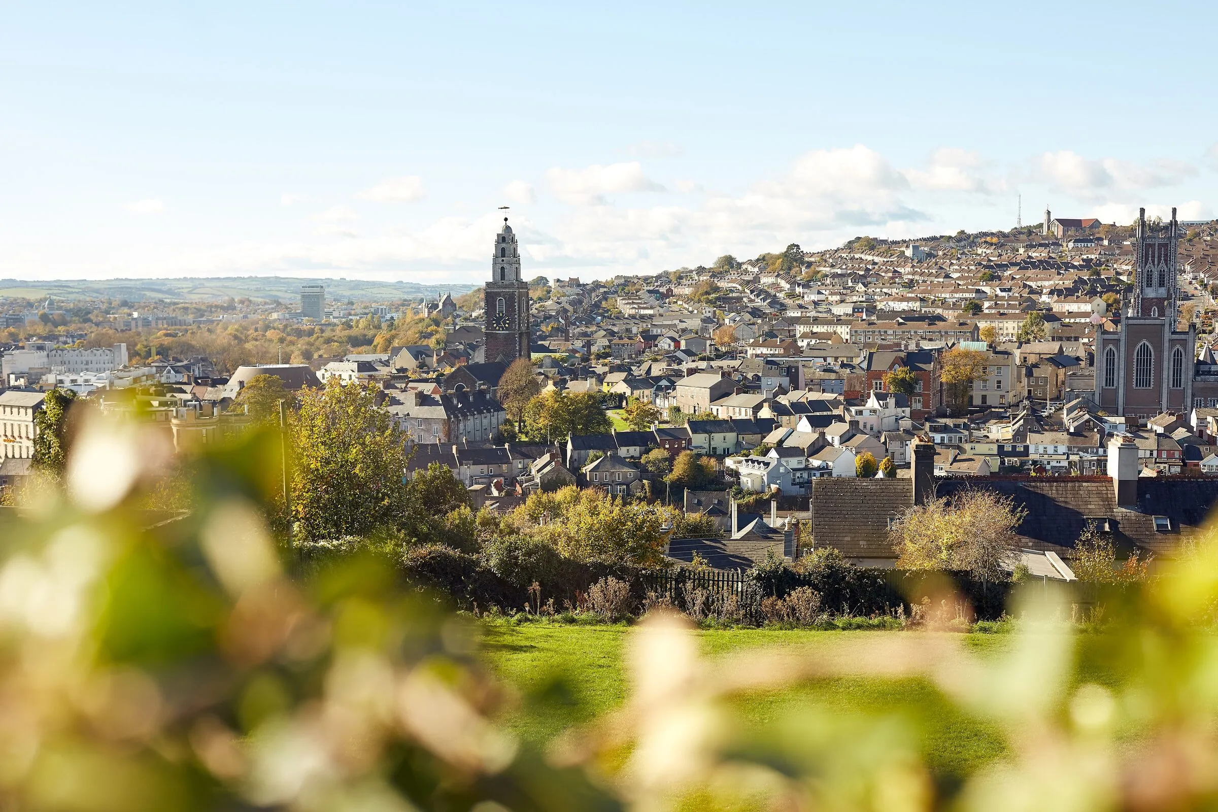 Cork city seen from the hills to the north on an autumn afternoon, the tower of St Anne’s Shandon at the centre and the North Cathedral to the right above the terraces