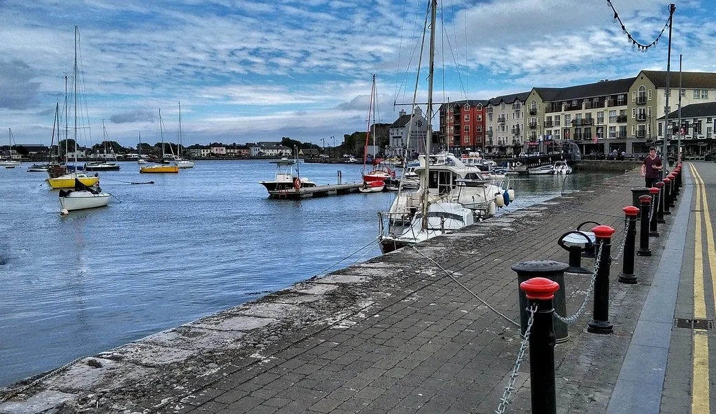 Dungarvan quay, with yachts moored in the harbour and the terraces of the town behind